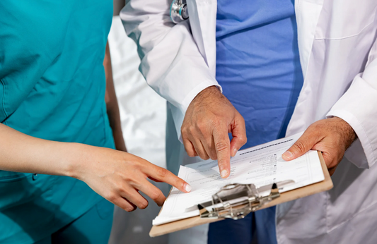 Nursing student in a hospital setting, engaging with a preceptor and gaining hands-on clinical experience.