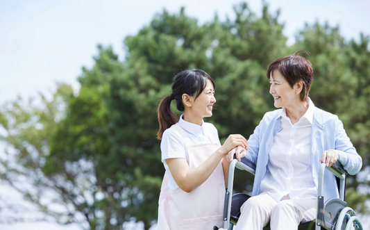 Nursing student and preceptor having a discussion outdoors about patient care and clinical training – mentorship in nursing education